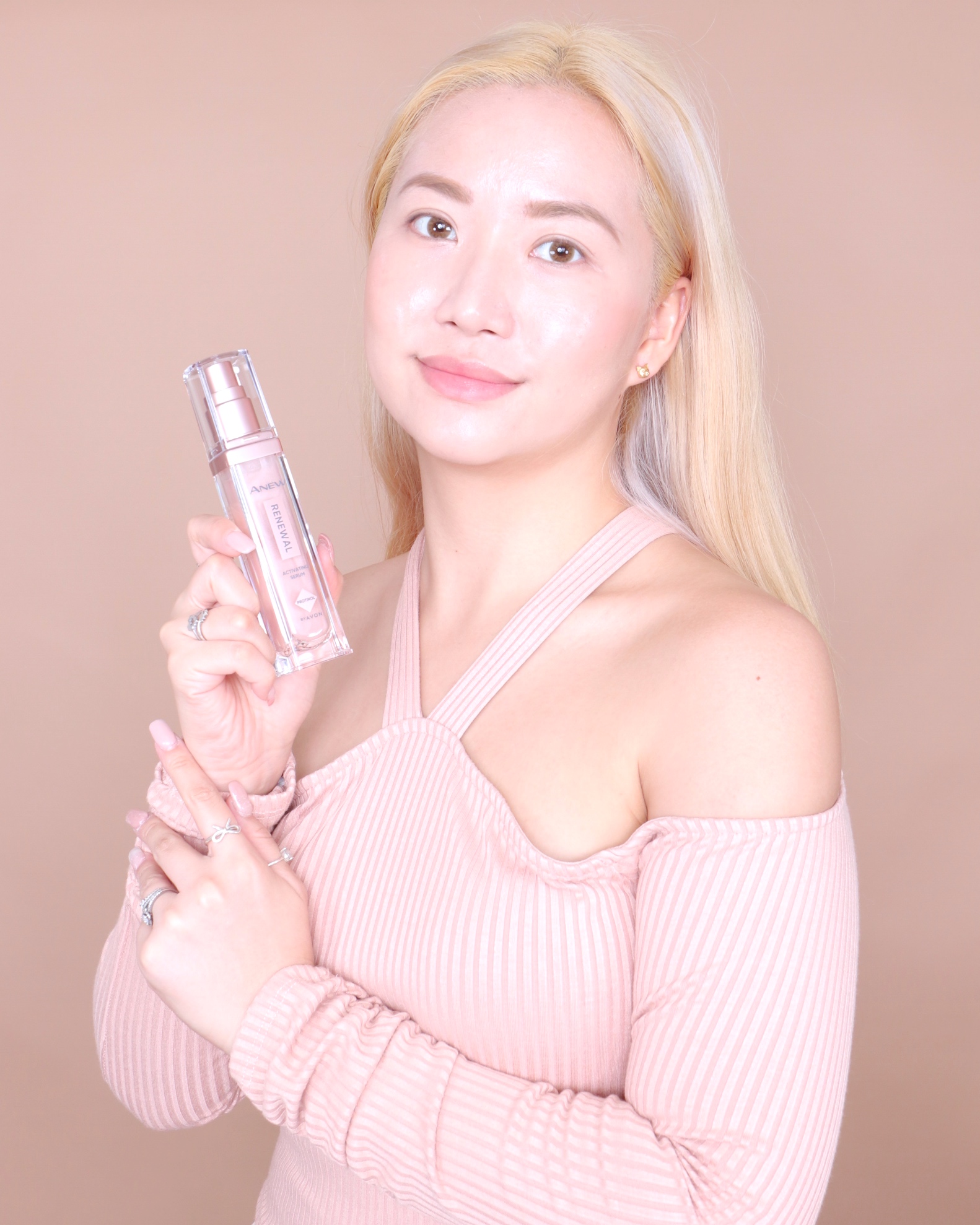 Mari Posing with AVON ANEW Renewal Serum