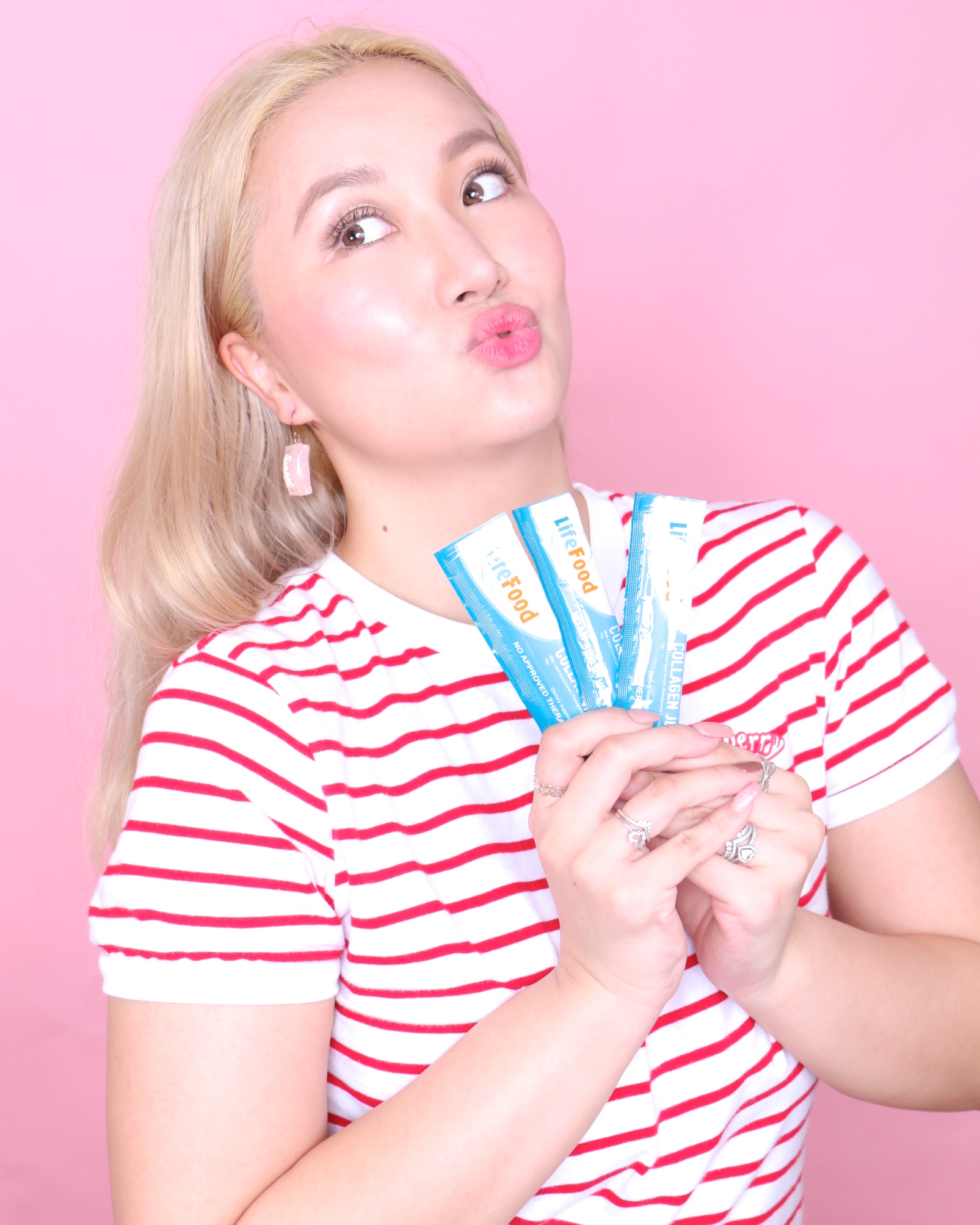 Mari Posing with LifeFood Collagen Jelly Sachets